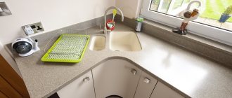 Acrylic countertop in the kitchen with corner sink