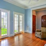 White entrance doors in the living room of a private house