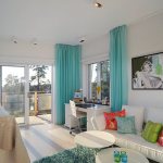 Turquoise curtains on the living room windows