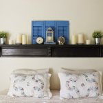 Wooden shelf above the head of the bed