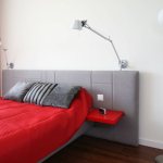 Double socket on the bedroom wall for a floor lamp