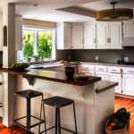 Photo of a kitchen with a peninsula equipped with a bar counter