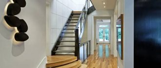 Hall with stairs in a spacious apartment