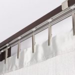 How to hang a curtain on the wall: useful tips