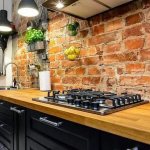 Brick wall in the work area in the kitchen