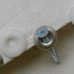 Fiberboard bottom fastening with self-tapping screws and washers