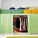 Children&#39;s loft bed with wardrobe below