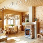 Kitchen-living room in a country house made of timber