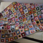 Unusual bedspread made of multi-colored squares