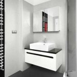 Heated towel rail in the bathroom interior