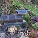 If desired, the grill can be decorated very attractively, for example, in the form of a steam locomotive