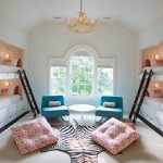 Mirrored children&#39;s bunk beds made of natural wood in a modern nursery