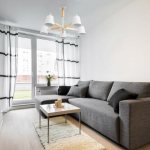 Gray sofa in the living room interior