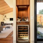 Modern interior of a private house with a minibar in a niche